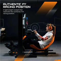 Driver seated in Playseat Formula Instinct McLaren Racing Edition cockpit
