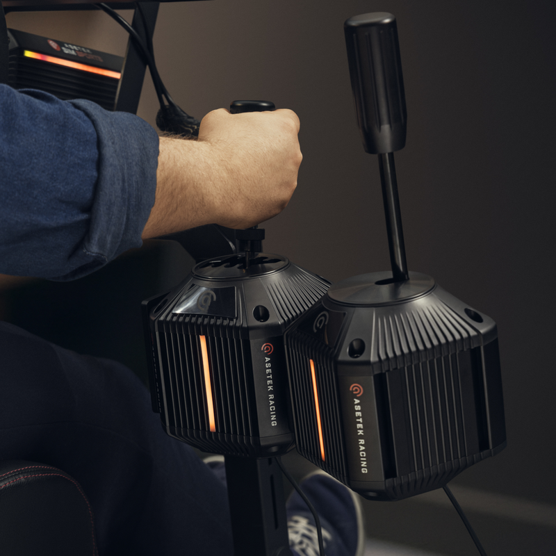 Asetek Dual Mode Shifter on the right and separate Load Cell Handbrake on the left; handbrake not included